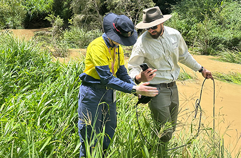 Two workers checking water quality