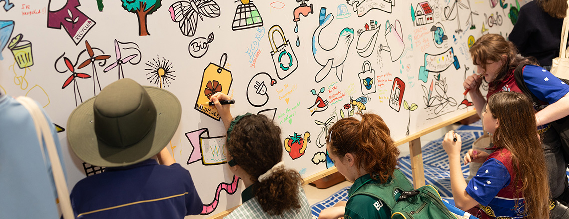 Children drawing on mural