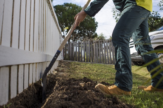 how to stop a dog from going under the fence