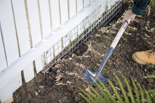 how to stop a dog from going under the fence